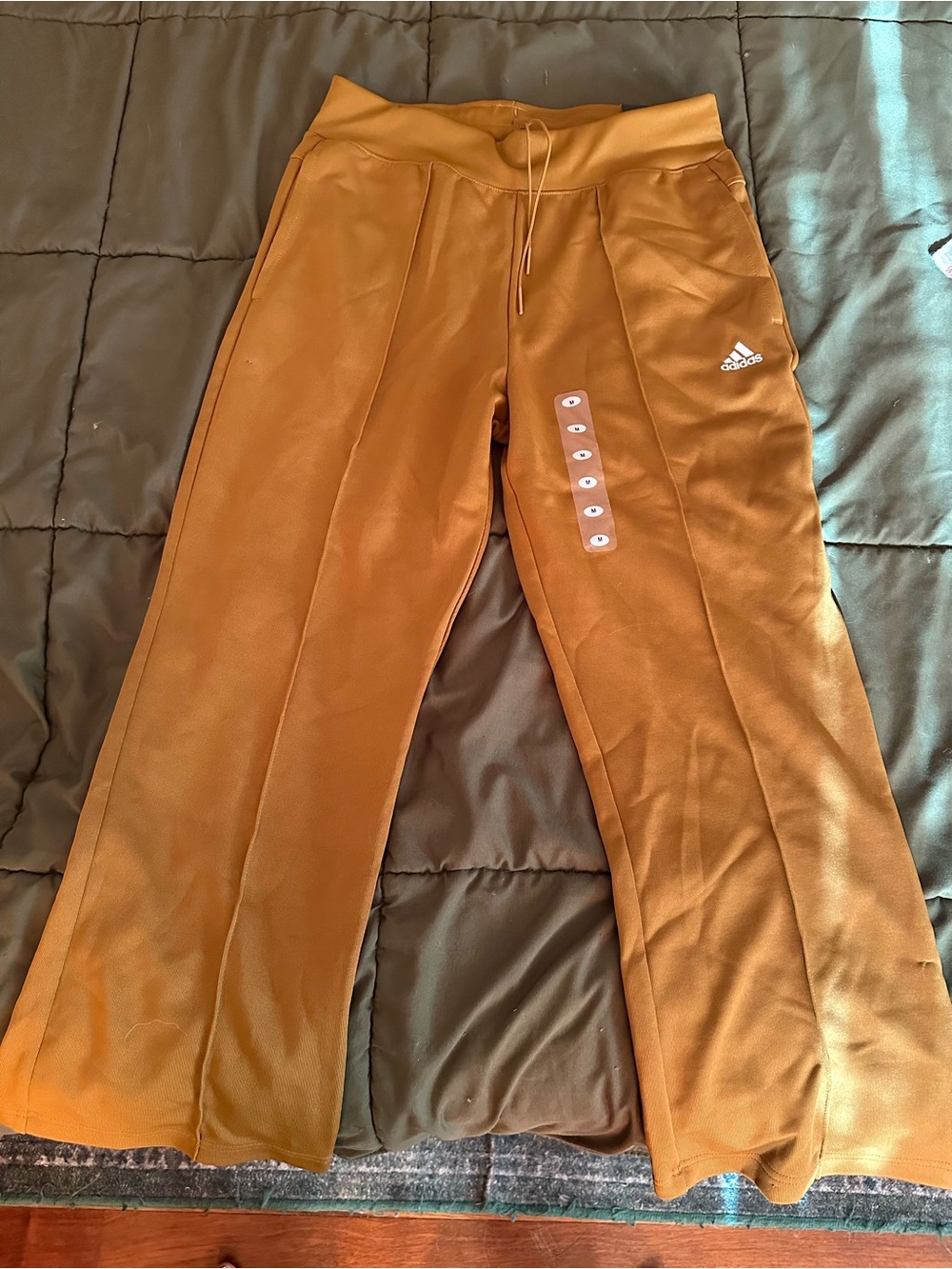 ADIDAS flared pants. Brand new with tags. Size medium. Burnt orange/rust color.